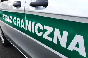 Napis Straż Graniczna na boku samochodu służbowego. Napis Straż Graniczna na boku samochodu służbowego.