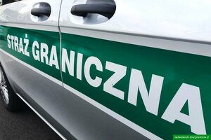 Napis Straż Graniczna na boku samochodu służbowego. Napis Straż Graniczna na boku samochodu służbowego.
